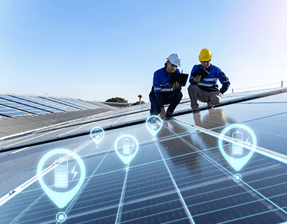 Engineers reviewing digital energy storage and solar panel data