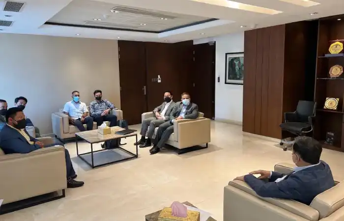Business meeting in a lounge with participants seated apart