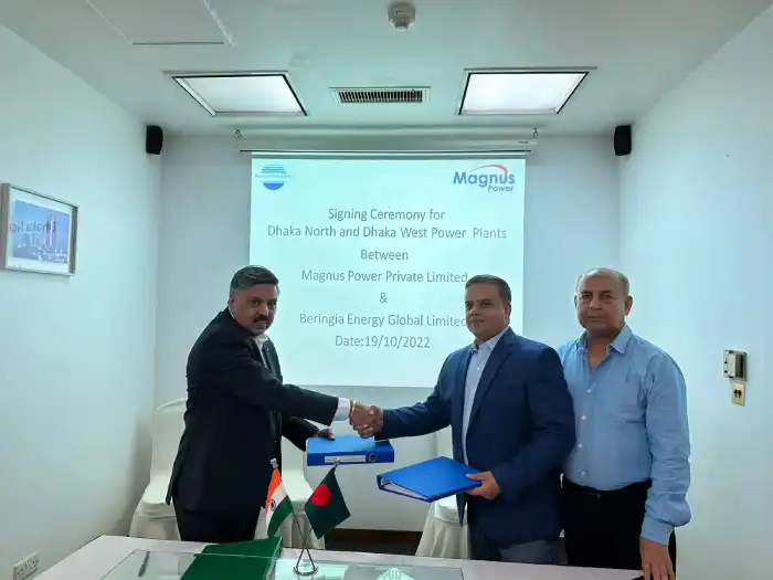 Business representatives shaking hands after a signing ceremony