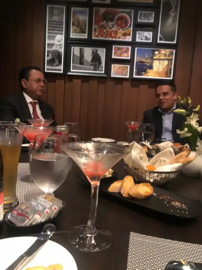 Two colleagues meeting over dinner