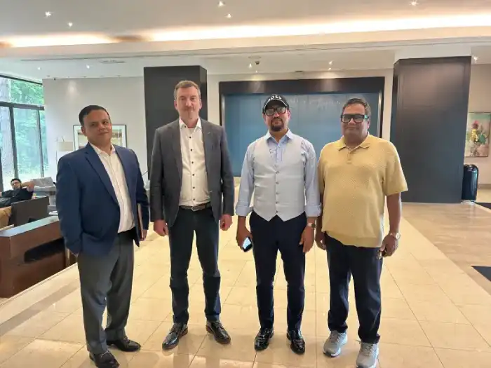 Four business representatives standing together in a lobby