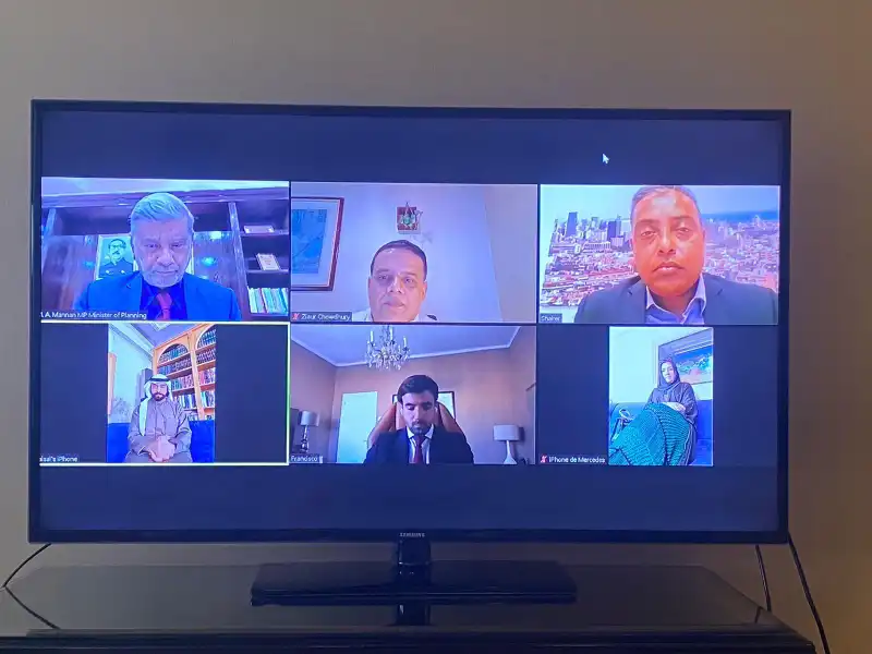 Remote meeting shown on a television screen