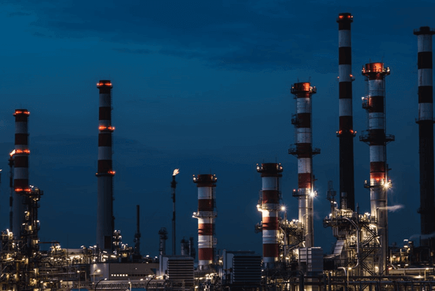 Illuminated gas power facility at dusk
