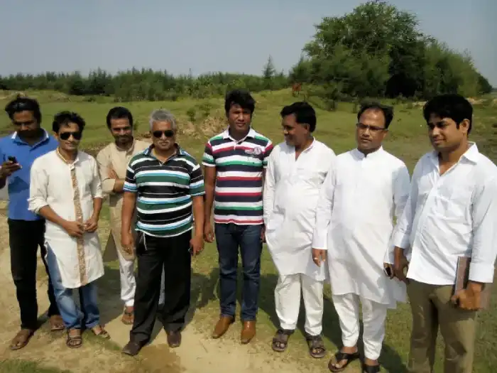 Field inspection team standing together on open land