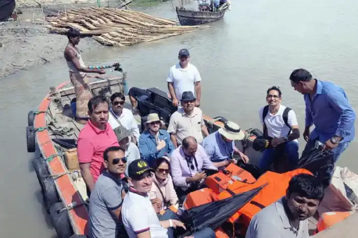 Field inspection group seated together in a river boat