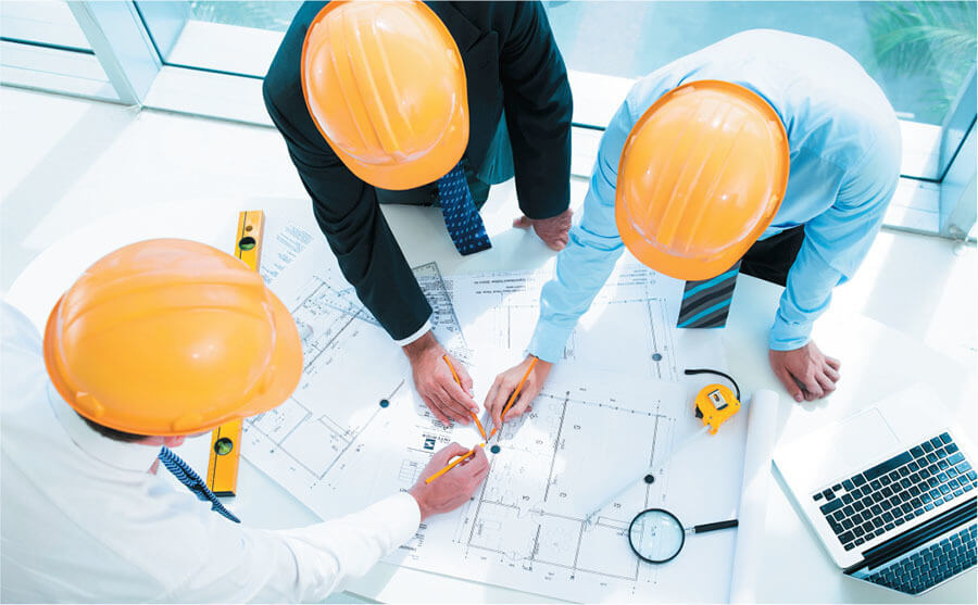 Project team reviewing engineering and investment plans