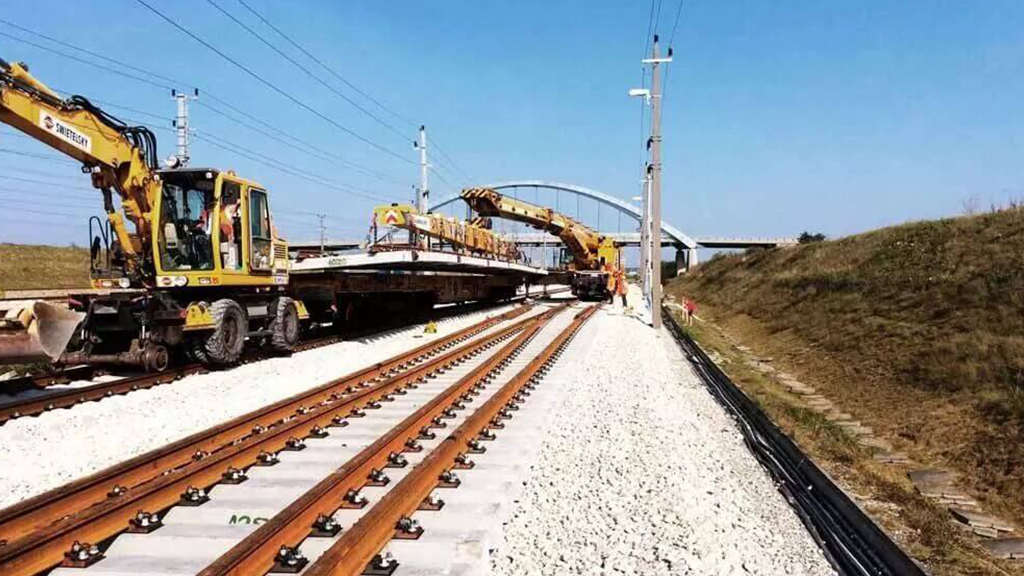 Railway track construction with heavy equipment
