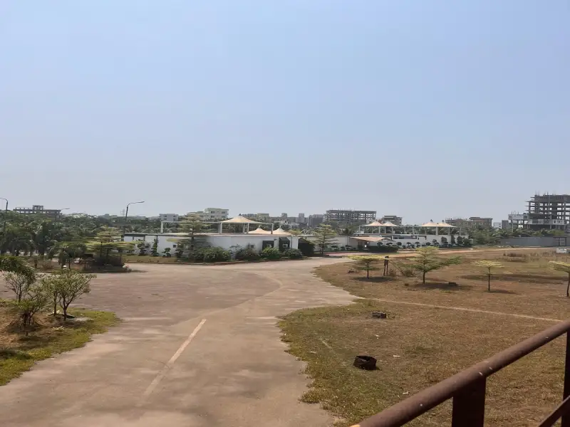 Road and buildings across a developing project site