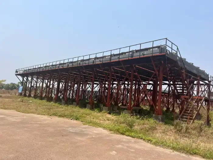 Elevated steel structure on supports at an industrial site