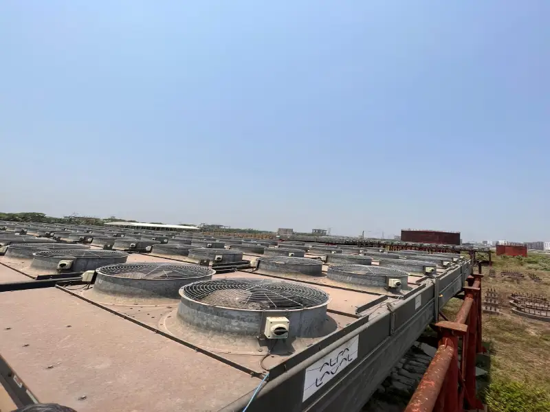 Rows of industrial cooling units at a project site