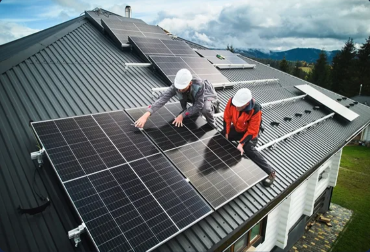 Solar technicians installing panels on a rooftop